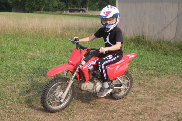 Image of a young boy on a mini bike.