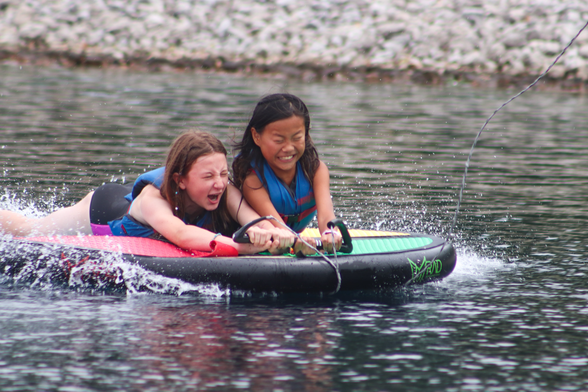 Image of two girls wake boarding.