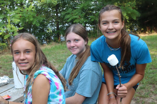 Image of three girls preparing to make smore's